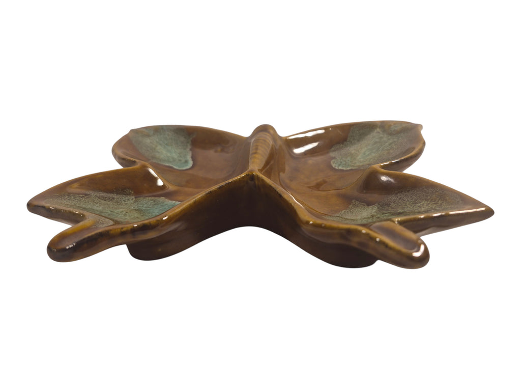Ceramic leaf-shaped dish on a white background