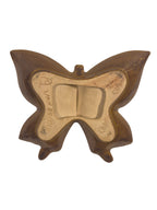 Butterfly-shaped mold on a white background
