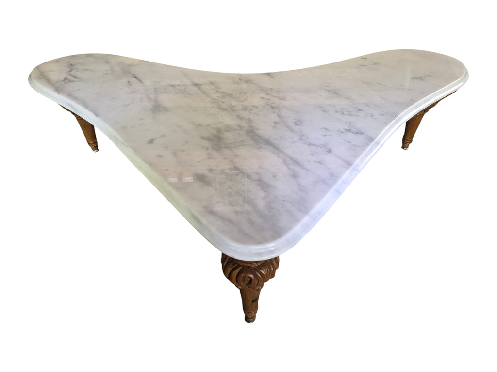 Vintage biomorphic white marble coffee table with carved walnut-toned wood legs and brass foot caps.