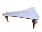 Vintage biomorphic white marble coffee table with carved walnut-toned wood legs and brass foot caps.