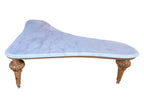 Vintage biomorphic white marble coffee table with carved walnut-toned wood legs and brass foot caps.