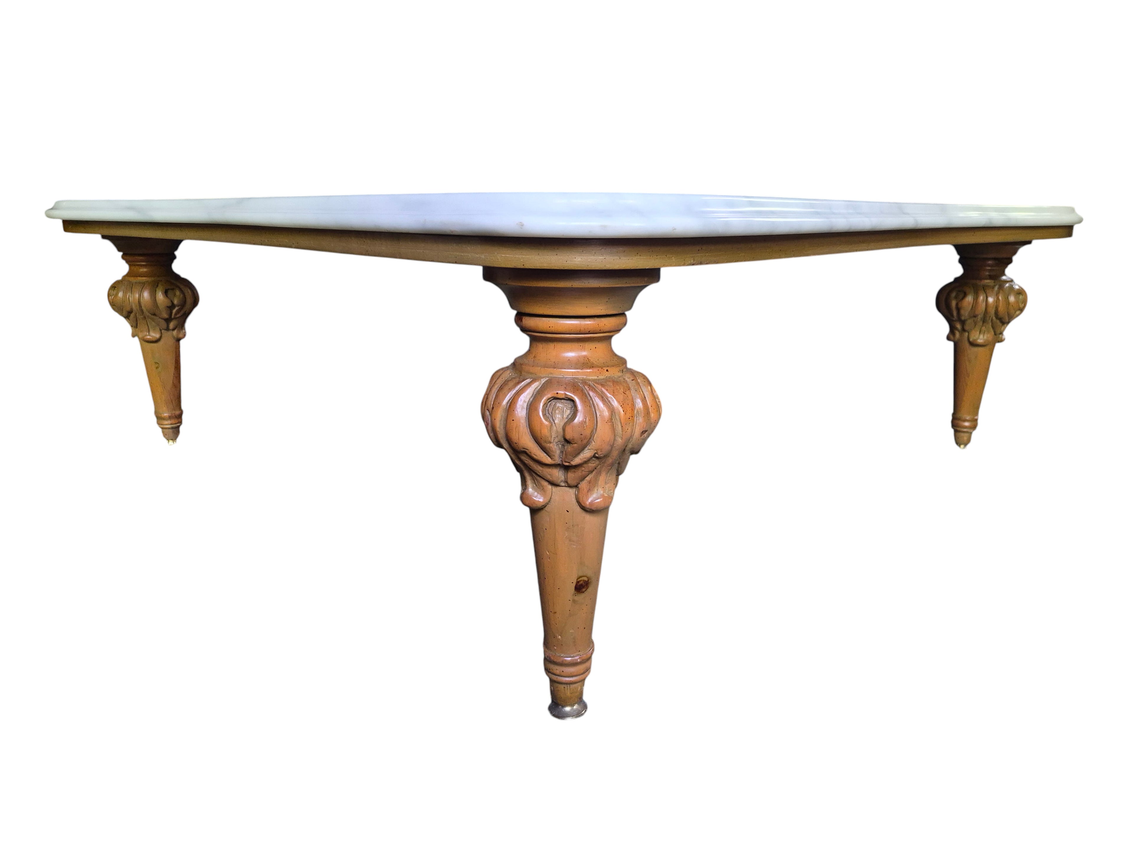 Vintage biomorphic white marble coffee table with carved walnut-toned wood legs and brass foot caps.