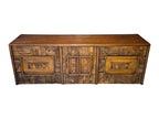 A vintage mid-century modern Lane Pueblo oak credenza featuring Brutalist geometric carved wood drawer fronts.
