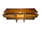 A vintage mid-century modern Lane Pueblo oak credenza featuring Brutalist geometric carved wood drawer fronts.