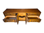 A vintage mid-century modern Lane Pueblo oak credenza featuring Brutalist geometric carved wood drawer fronts.