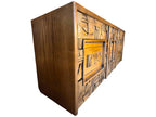 A vintage mid-century modern Lane Pueblo oak credenza featuring Brutalist geometric carved wood drawer fronts.