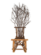 Vintage, handmade rustic twig chair in a full front view featuring tall, branching backrest, slatted branch seat, and cross-braced legs. Made from raw branches with unpeeled bark. Sold vintage as-is in very good condition.