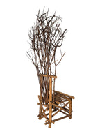 Vintage, handmade rustic twig chair in a right-back view featuring tall, branching backrest, slatted branch seat, and cross-braced legs. Made from raw branches with unpeeled bark. Sold vintage as-is in very good condition.