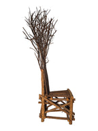 Vintage, handmade rustic twig chair in a right profile view featuring tall, branching backrest, slatted branch seat, and cross-braced legs. Made from raw branches with unpeeled bark. Sold vintage as-is in very good condition.