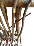 Vintage, handmade rustic twig chair in a close-up detail view featuring tall, branching backrest, slatted branch seat, and cross-braced legs. Made from raw branches with unpeeled bark. Sold vintage as-is in very good condition.