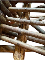 Vintage, handmade rustic twig chair in a close-up detail view featuring tall, branching backrest, slatted branch seat, and cross-braced legs. Made from raw branches with unpeeled bark. Sold vintage as-is in very good condition.
