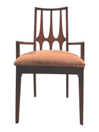 Mid Century Modern Broyhill Brasilia walnut arm dining chair in a front-facing view. Features a signature cathedral slatted back and original beige geometric upholstered seat. Vintage as-is, gently refreshed, as part of a set of six.