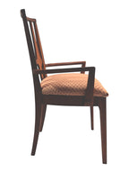 Mid Century Modern Broyhill Brasilia walnut arm dining chair in a right profile view. Features a signature cathedral slatted back and original beige geometric upholstered seat. Vintage as-is, gently refreshed, as part of a set of six.