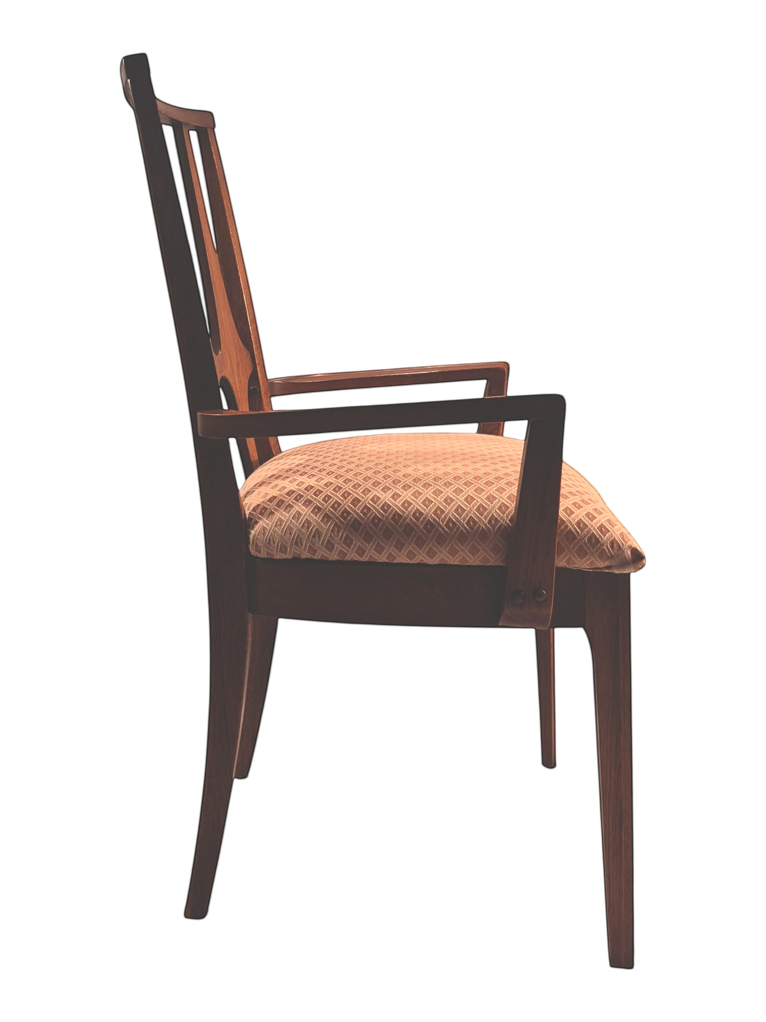 Mid Century Modern Broyhill Brasilia walnut arm dining chair in a right profile view. Features a signature cathedral slatted back and original beige geometric upholstered seat. Vintage as-is, gently refreshed, as part of a set of six.