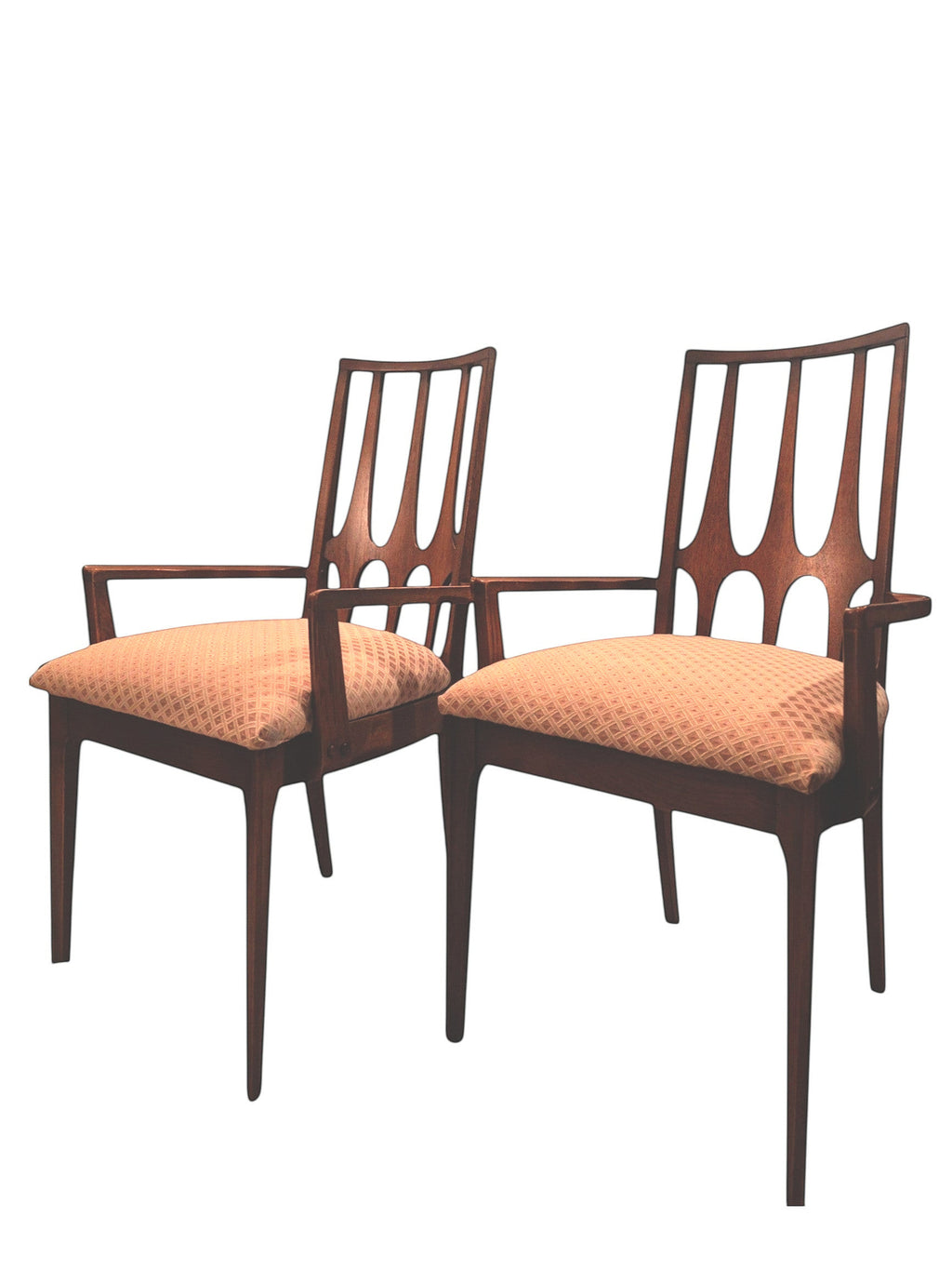 Mid Century Modern Broyhill Brasilia walnut arm dining chair displayed two side by side. Features a signature cathedral slatted back and original beige geometric upholstered seat. Vintage as-is, gently refreshed, as part of a set of six.