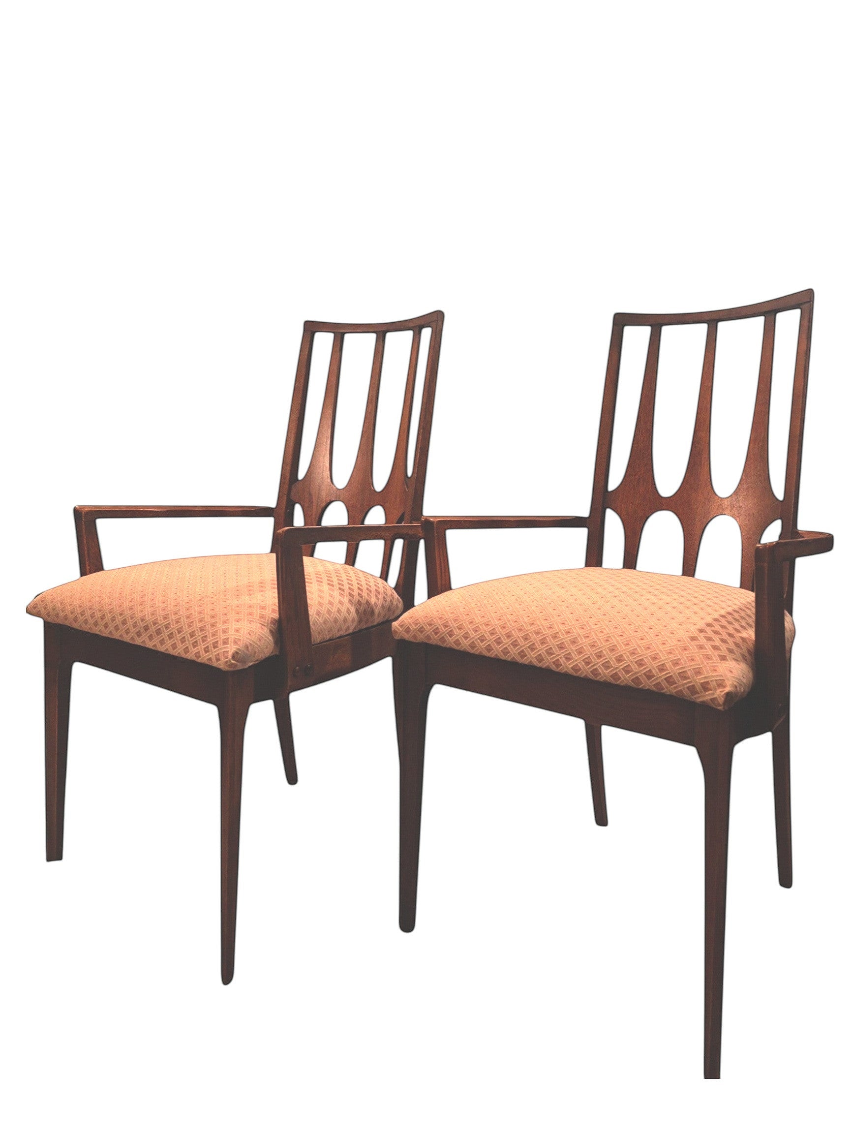 Mid Century Modern Broyhill Brasilia walnut arm dining chair displayed two side by side. Features a signature cathedral slatted back and original beige geometric upholstered seat. Vintage as-is, gently refreshed, as part of a set of six.