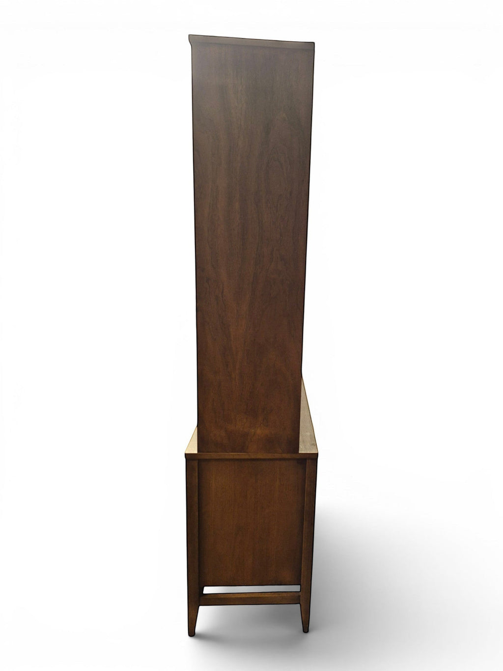 Mid Century Modern Broyhill Brasilia walnut breakfront China cabinet in a left profile view. Features the Brasilia collection's catseye sweeping arches and tapered legs, with brass hardware and glass display doors. Vintage as-is, gently refreshed, including credenza base with three drawers and two doors and top display deck with two doors.