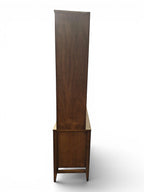 Mid Century Modern Broyhill Brasilia walnut breakfront China cabinet in a left profile view. Features the Brasilia collection's catseye sweeping arches and tapered legs, with brass hardware and glass display doors. Vintage as-is, gently refreshed, including credenza base with three drawers and two doors and top display deck with two doors.