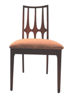 Mid Century Modern Broyhill Brasilia walnut side dining chair in a front view. Features a signature cathedral slatted back and original beige geometric upholstered seat. Vintage as-is, gently refreshed, as part of a set of six.