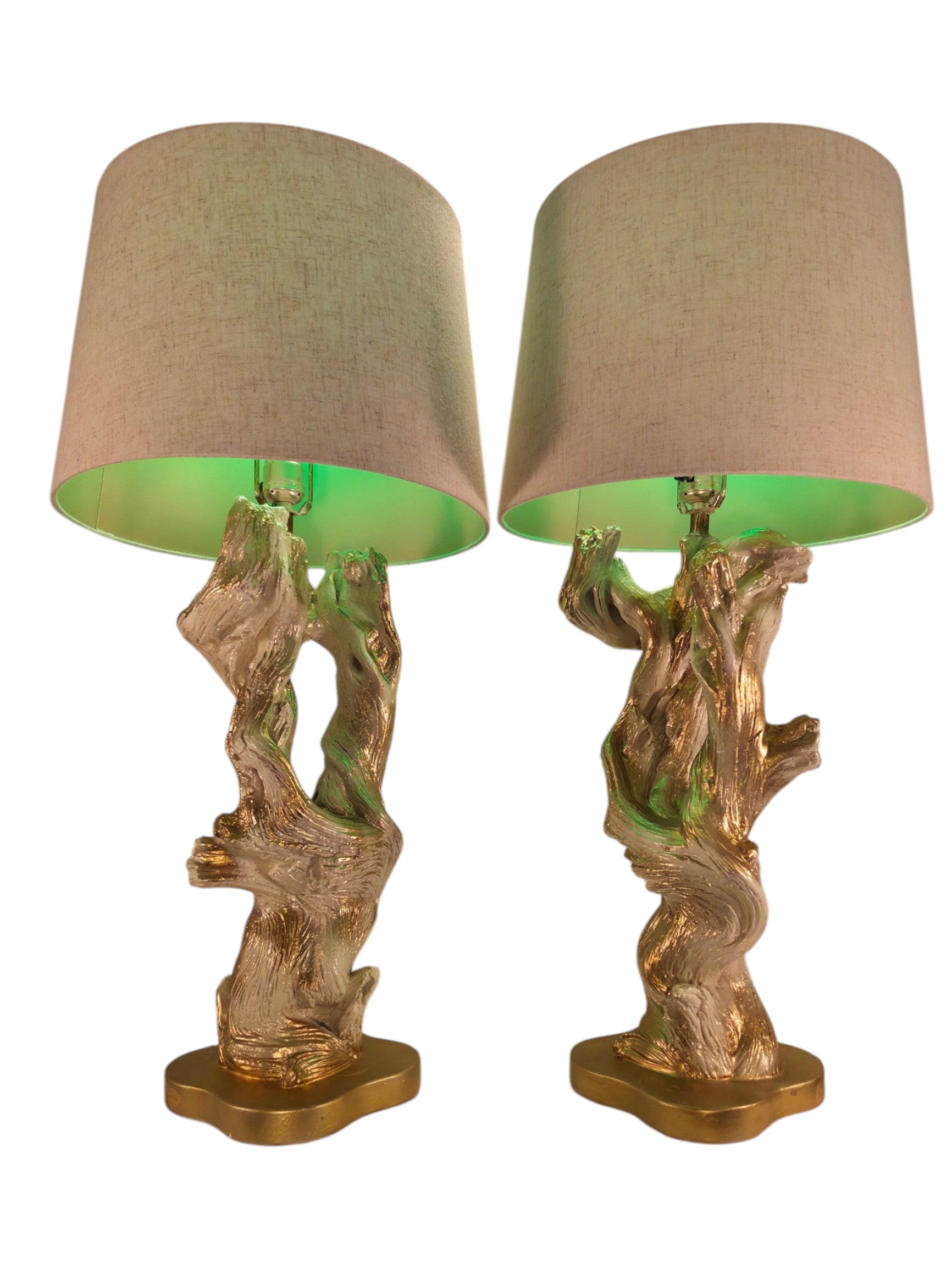 Vintage 1950s mid-century modern sculptural table lamp made of chalkware plaster, shaped like twisted biomorphic driftwood featuring a white gesso finish with hand-painted gold leaf highlights, sitting on a scalloped gold base against a white backdrop.