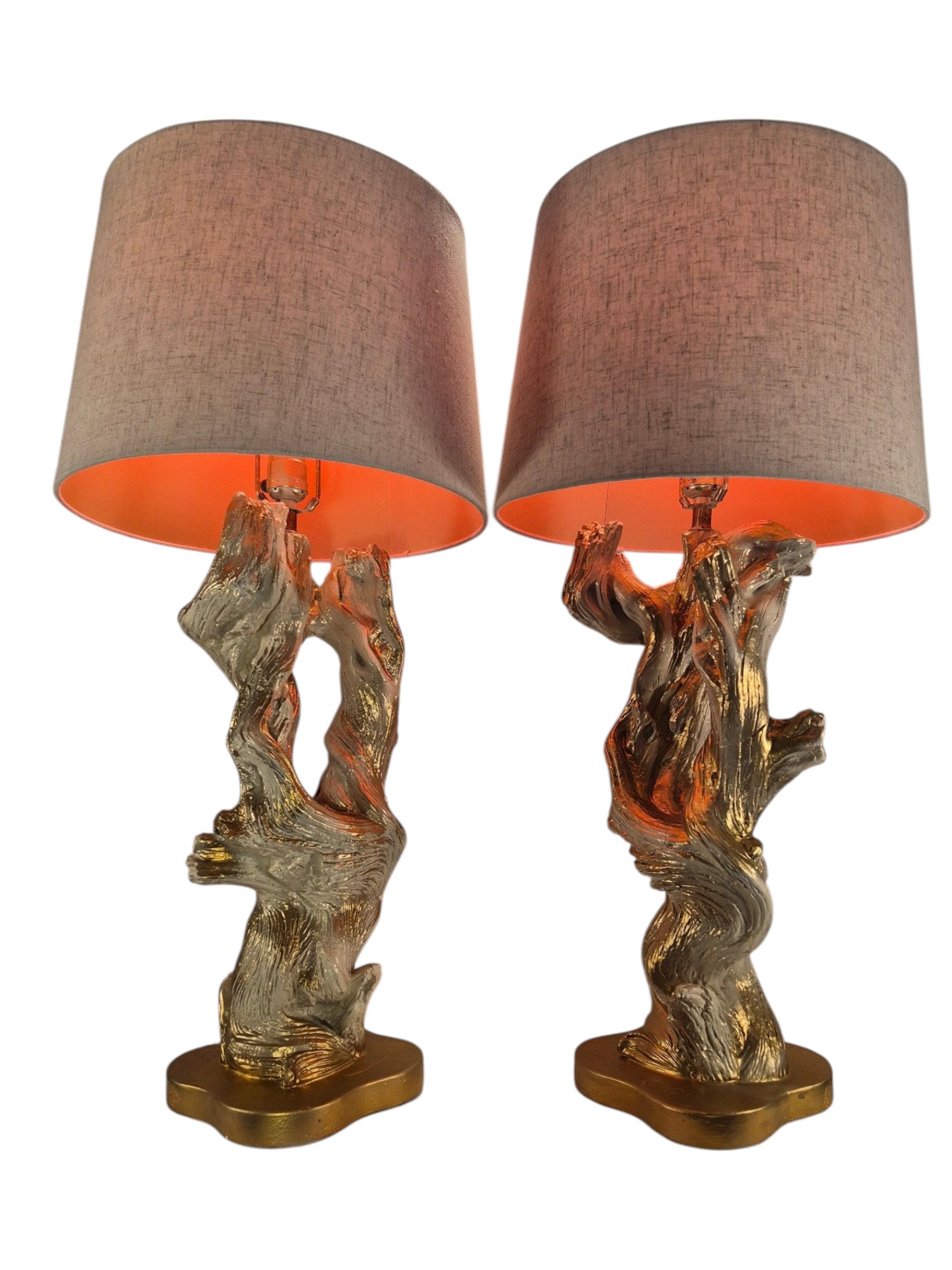Vintage 1950s mid-century modern sculptural table lamp made of chalkware plaster, shaped like twisted biomorphic driftwood featuring a white gesso finish with hand-painted gold leaf highlights, sitting on a scalloped gold base against a white backdrop.