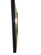 Curated Vintage Design large framed wall art viewed from the side showing a black frame and protective backing