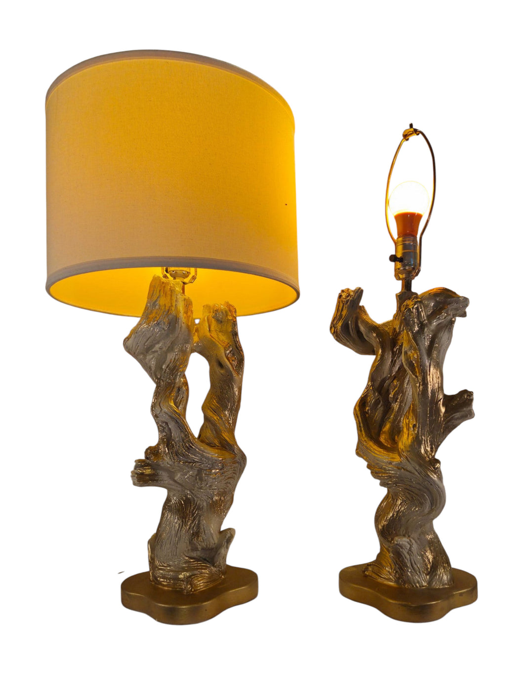 Vintage 1950s mid-century modern sculptural table lamp made of chalkware plaster, shaped like twisted biomorphic driftwood featuring a white gesso finish with hand-painted gold leaf highlights, sitting on a scalloped gold base against a white backdrop.