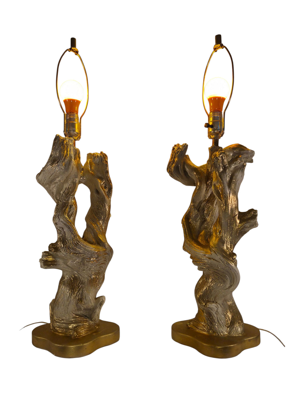 Vintage 1950s mid-century modern sculptural table lamp made of chalkware plaster, shaped like twisted biomorphic driftwood featuring a white gesso finish with hand-painted gold leaf highlights, sitting on a scalloped gold base against a white backdrop.