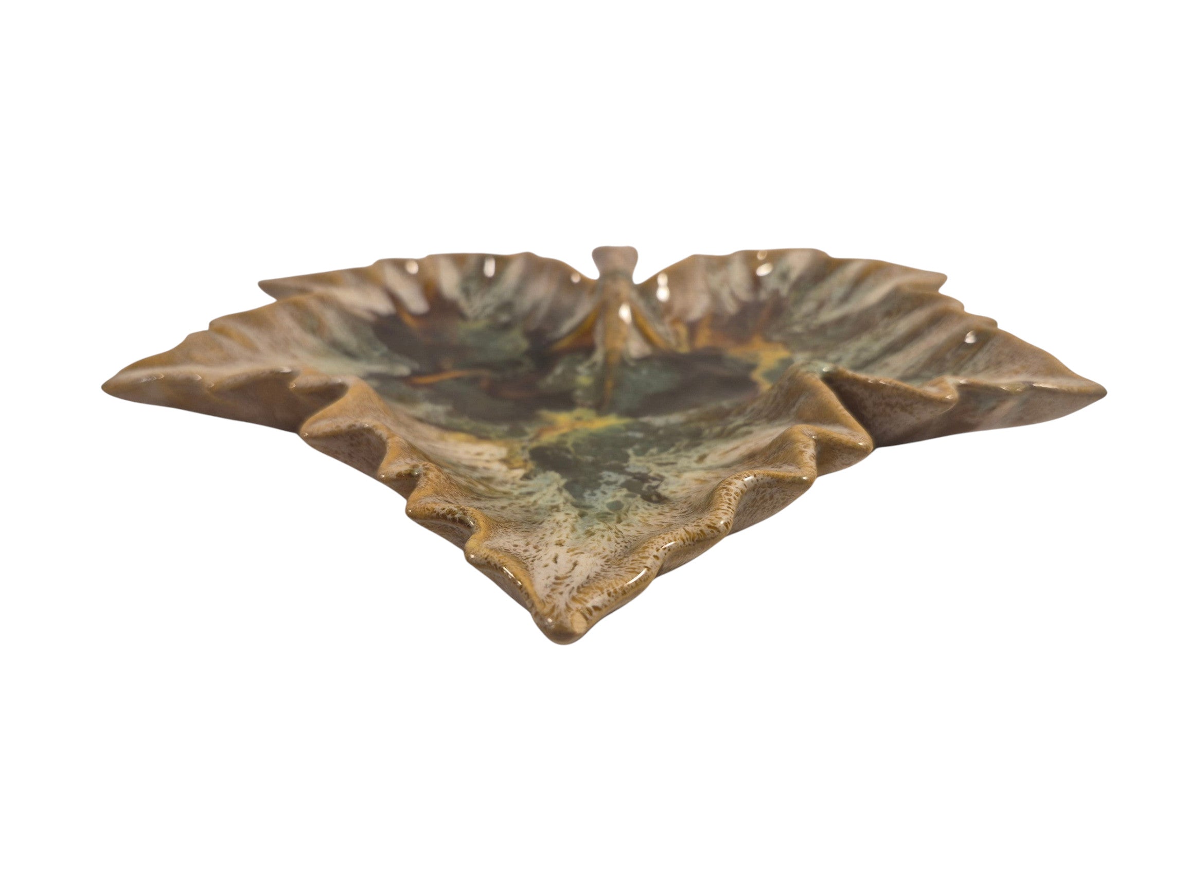 Curated Vintage Design leaf-shaped ceramic dish with multi-tonal green, brown, and yellow glaze. Decorative accent.