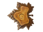 Curated Vintage Design leaf-shaped ceramic dish with multi-tonal green, brown, and yellow glaze. Features raised edges and a glossy finish.
