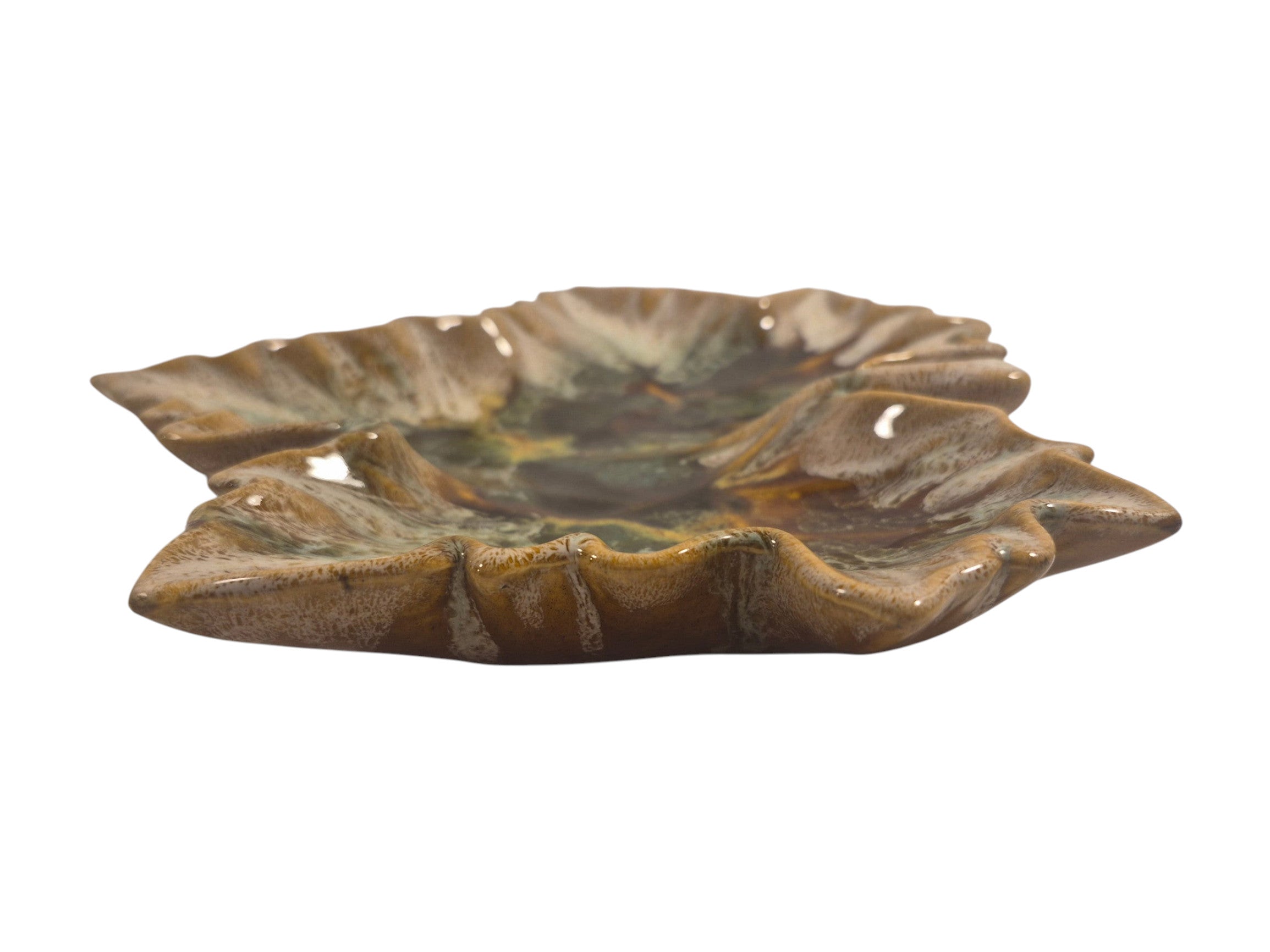 Curated Vintage Design leaf-shaped ceramic dish with multi-tonal green, brown, and yellow glaze. Glossy finish.