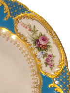 Curated Vintage Design ornate turquoise porcelain plate with gold filigree, floral accents, and scalloped edge.