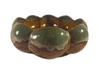 Curated Vintage Design scalloped ceramic serving bowl with brown exterior base and seafoam green rim, amber interior.